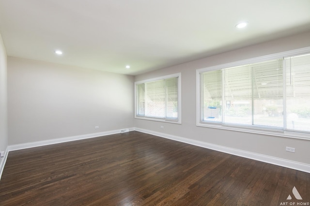 empty room featuring dark wood-type flooring