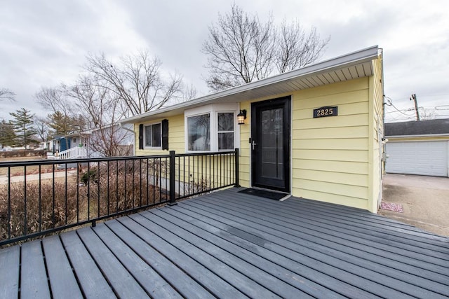 wooden deck with a garage