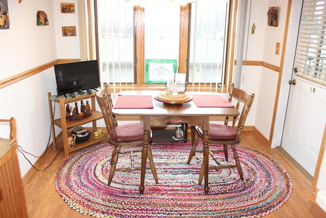 dining area with hardwood / wood-style floors