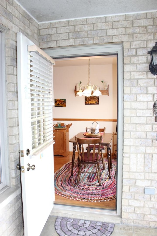 dining area with an inviting chandelier