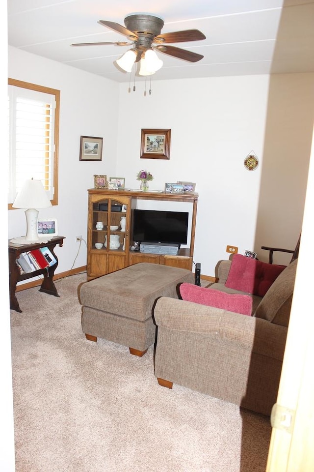 living room with light colored carpet and ceiling fan