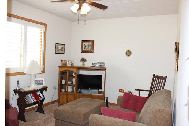 living room featuring carpet floors and ceiling fan