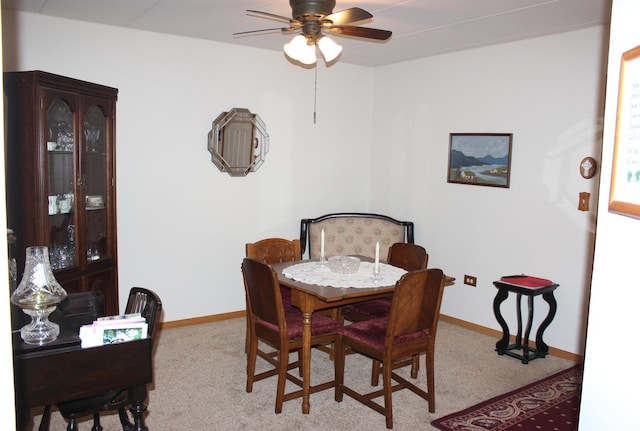 dining room featuring ceiling fan and carpet flooring