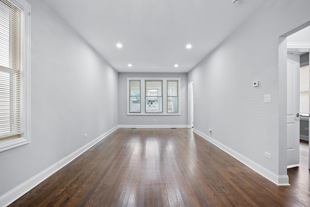 spare room featuring dark hardwood / wood-style flooring