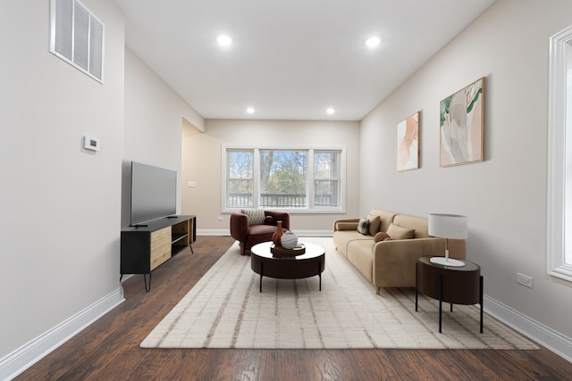 living room featuring dark hardwood / wood-style flooring