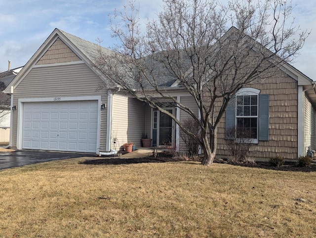 view of front of house featuring a garage and a front yard