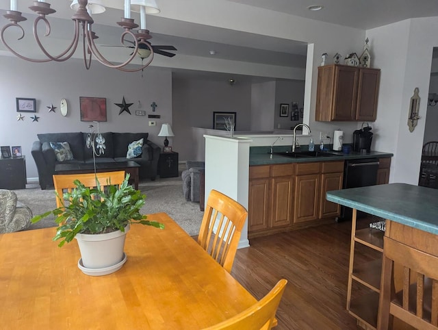 dining room with dark wood-type flooring, ceiling fan, and sink