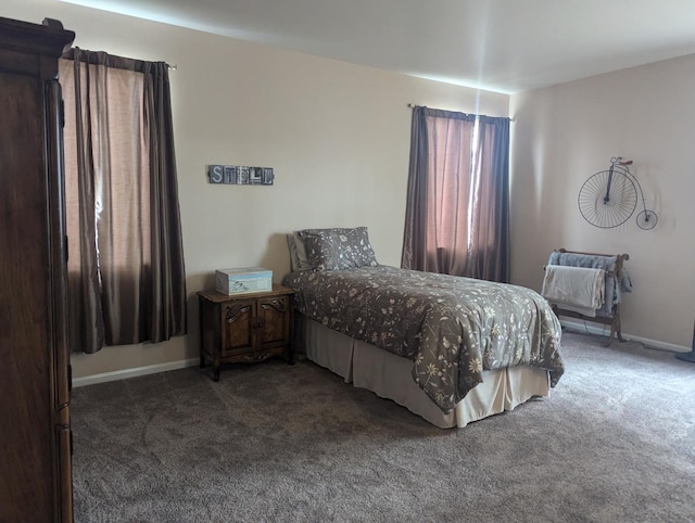 bedroom featuring dark carpet