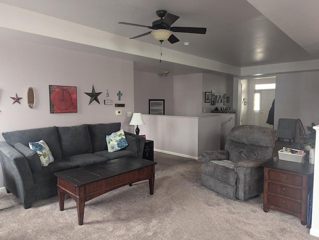 living room with light colored carpet and ceiling fan