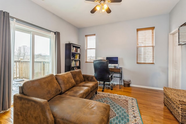 office space featuring a healthy amount of sunlight and wood finished floors