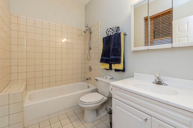 full bath with shower / bath combination, vanity, toilet, and tile patterned floors