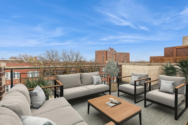 view of patio / terrace with a balcony and an outdoor hangout area