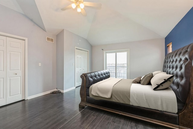 bedroom featuring lofted ceiling, ceiling fan, dark wood-style flooring, visible vents, and baseboards