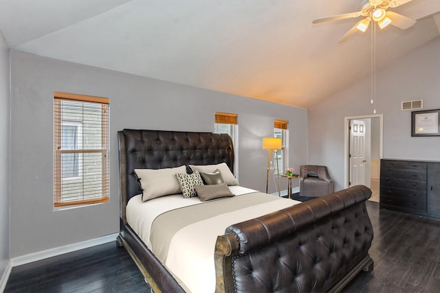 bedroom with vaulted ceiling, wood finished floors, visible vents, and baseboards