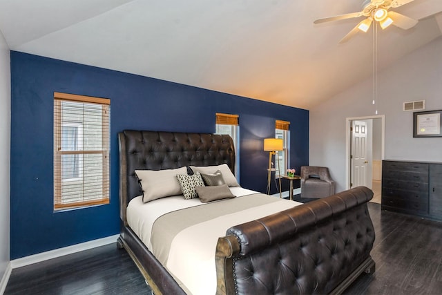 bedroom with lofted ceiling, wood finished floors, visible vents, and baseboards