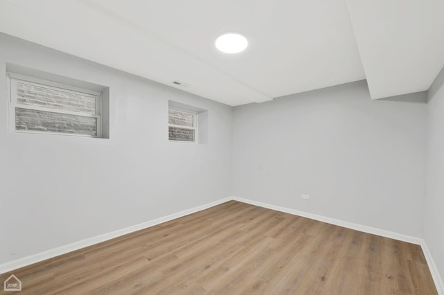 basement featuring light hardwood / wood-style flooring