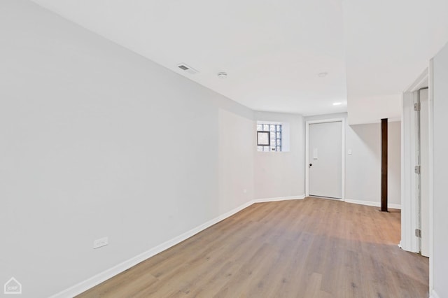 unfurnished room with light hardwood / wood-style flooring