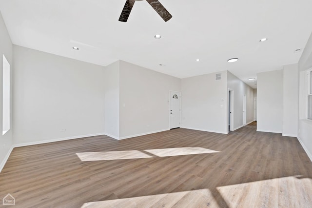 unfurnished living room with ceiling fan and light wood-type flooring