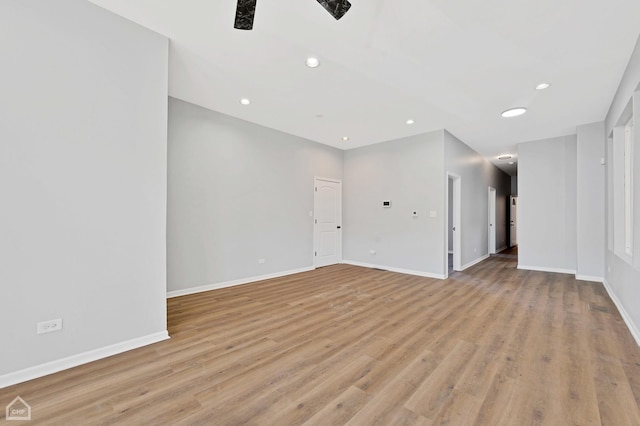 empty room with light hardwood / wood-style flooring