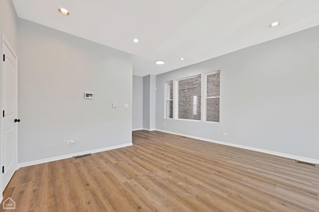 unfurnished room with light hardwood / wood-style flooring