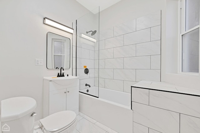 full bathroom with vanity, tiled shower / bath combo, and toilet