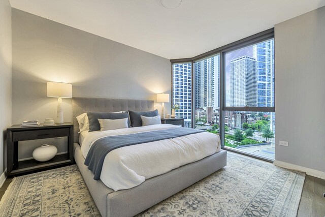 211 N Harbor Dr Unit 1909, Chicago, IL 60601 - bedroom with a wall of windows and wood-type flooring