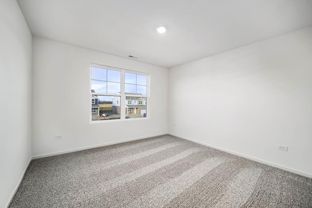 unfurnished room featuring carpet floors