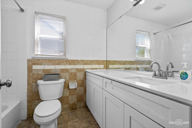 373 Wagonwood Rd, Round Lake, IL 60073 - full bath featuring tile walls, toilet, vanity, visible vents, and  shower combination