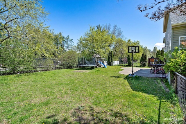 373 Wagonwood Rd, Round Lake, IL 60073 - view of yard featuring a playground, a trampoline, a fenced backyard, and a patio