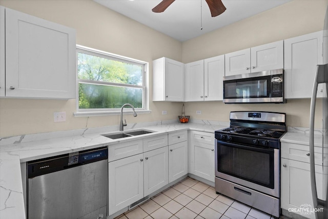 373 Wagonwood Rd, Round Lake, IL 60073 - kitchen with a sink, light stone counters, ceiling fan, white cabinets, and appliances with stainless steel finishes