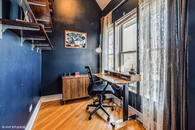 home office featuring light wood-style flooring and baseboards