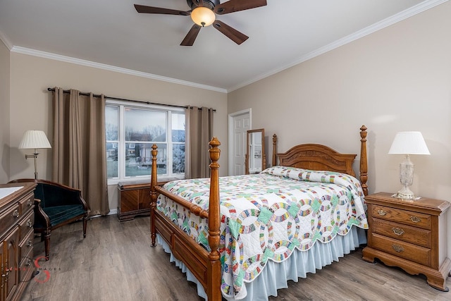 bedroom with crown molding, ceiling fan, and light wood-type flooring