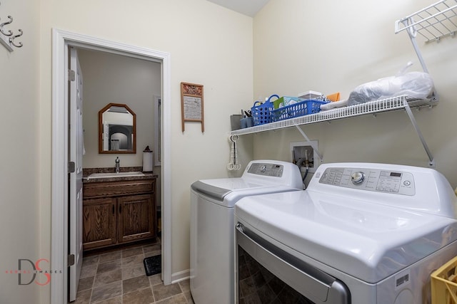 laundry area featuring sink and independent washer and dryer