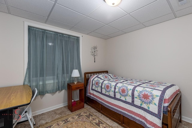 bedroom featuring a drop ceiling