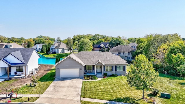 view of front of property featuring a garage and a front lawn