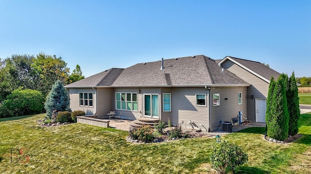 back of property with a patio, a yard, and cooling unit