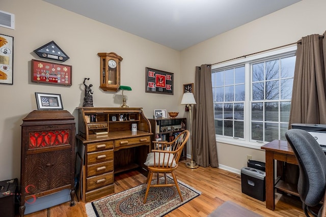 home office featuring light hardwood / wood-style flooring