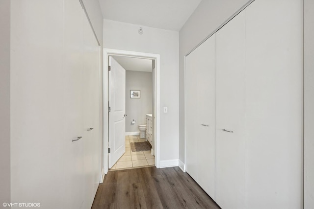 hall with dark hardwood / wood-style floors