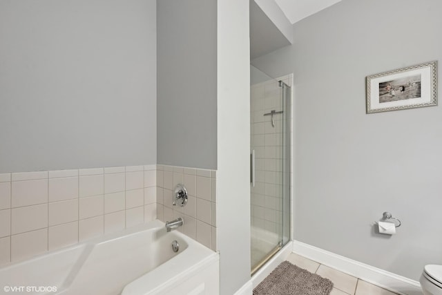 bathroom featuring tile patterned flooring, shower with separate bathtub, and toilet