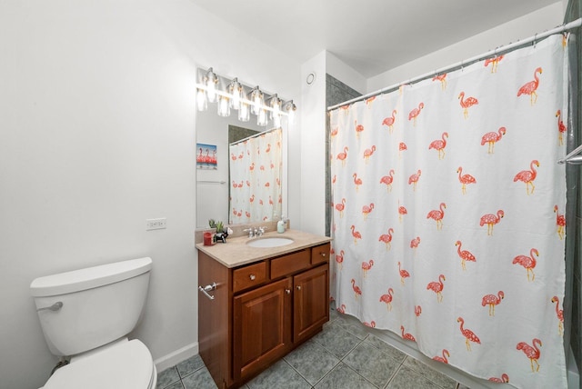 bathroom with vanity, tile patterned floors, and toilet