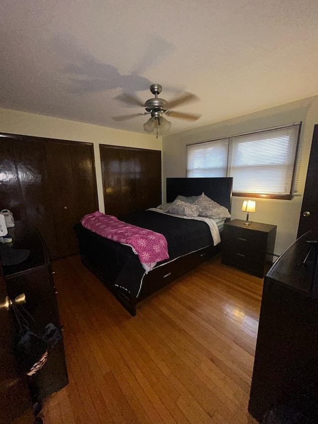 bedroom featuring hardwood / wood-style floors and ceiling fan