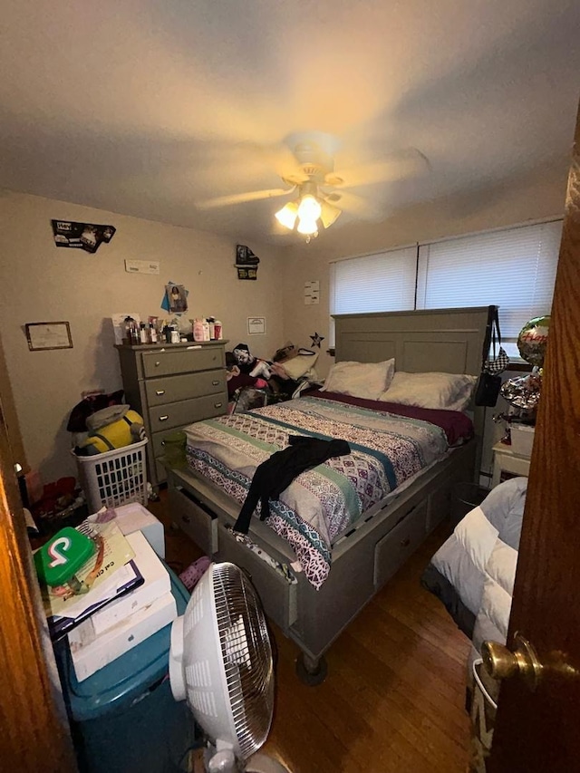 bedroom with ceiling fan and wood-type flooring