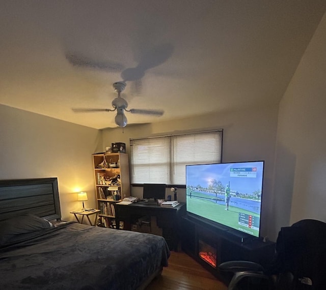 bedroom featuring hardwood / wood-style flooring and ceiling fan