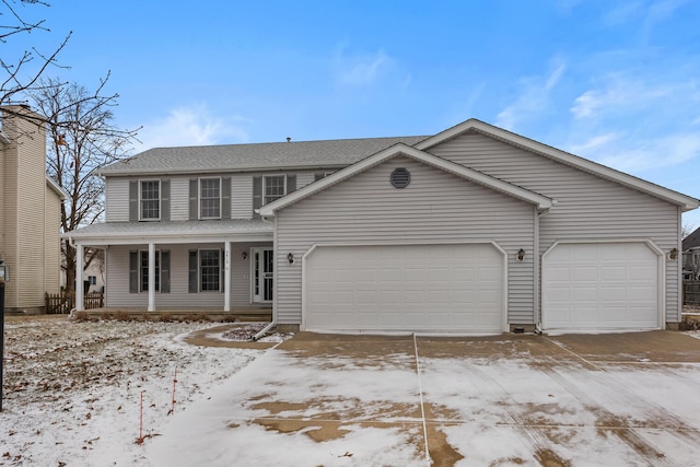 view of front of property with an attached garage and a porch