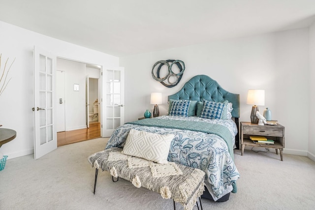 bedroom featuring french doors and carpet