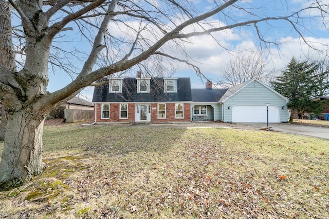 view of front facade with a garage and a front lawn