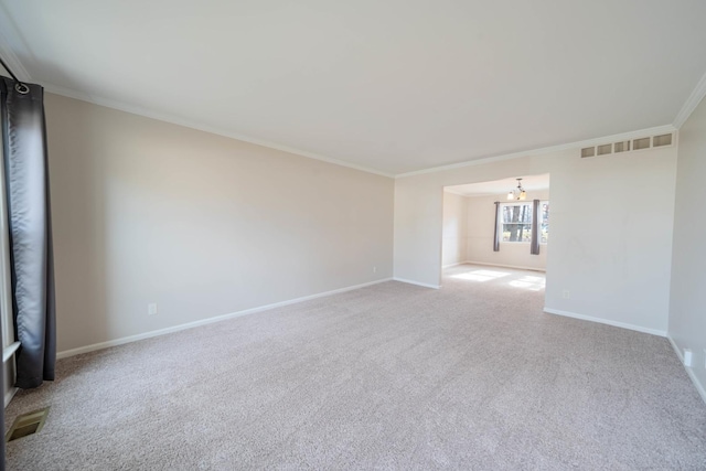 carpeted empty room with crown molding