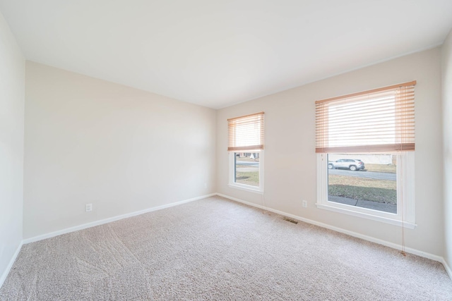 spare room with carpet floors