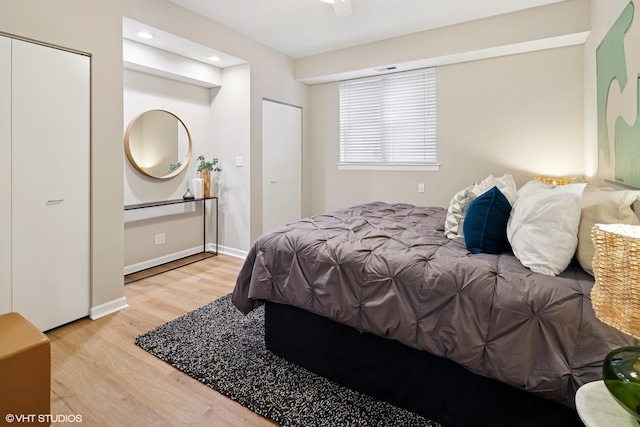 bedroom with recessed lighting, baseboards, and wood finished floors