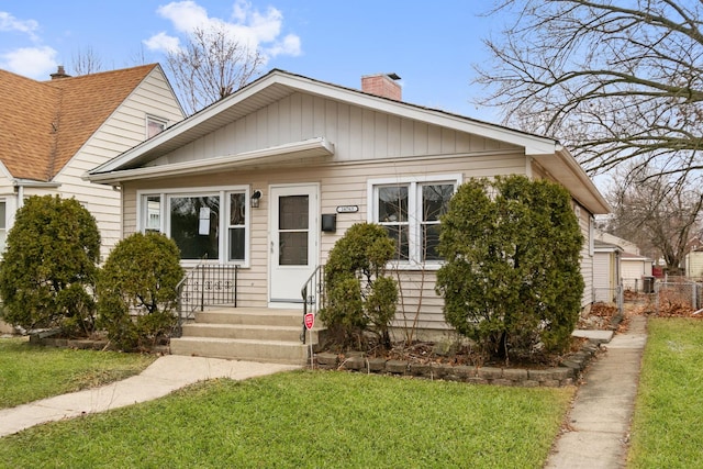 bungalow with a front lawn